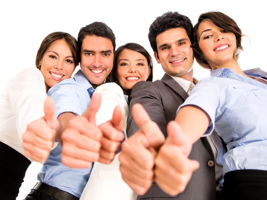 Happy business team with thumbs up - isolated over a white background